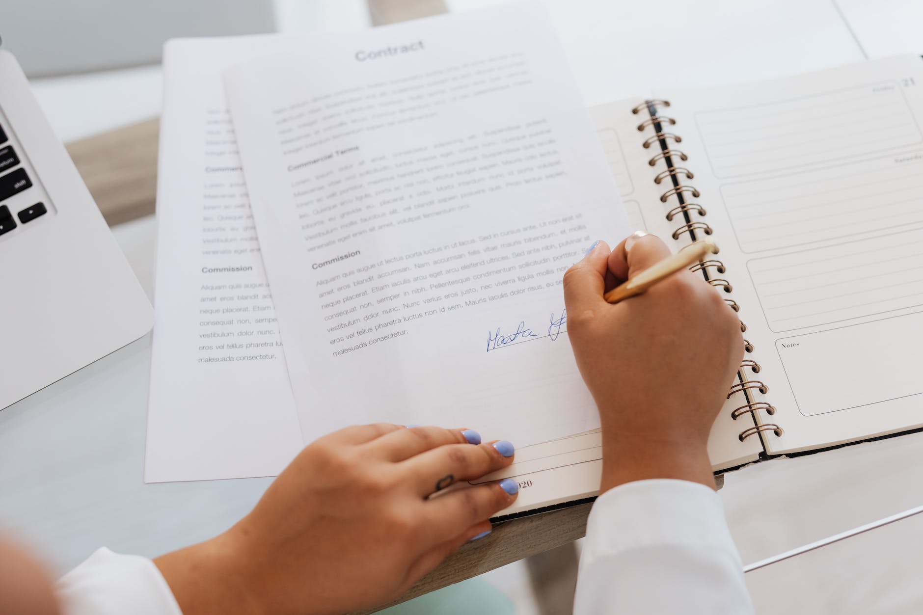 person signing a contract