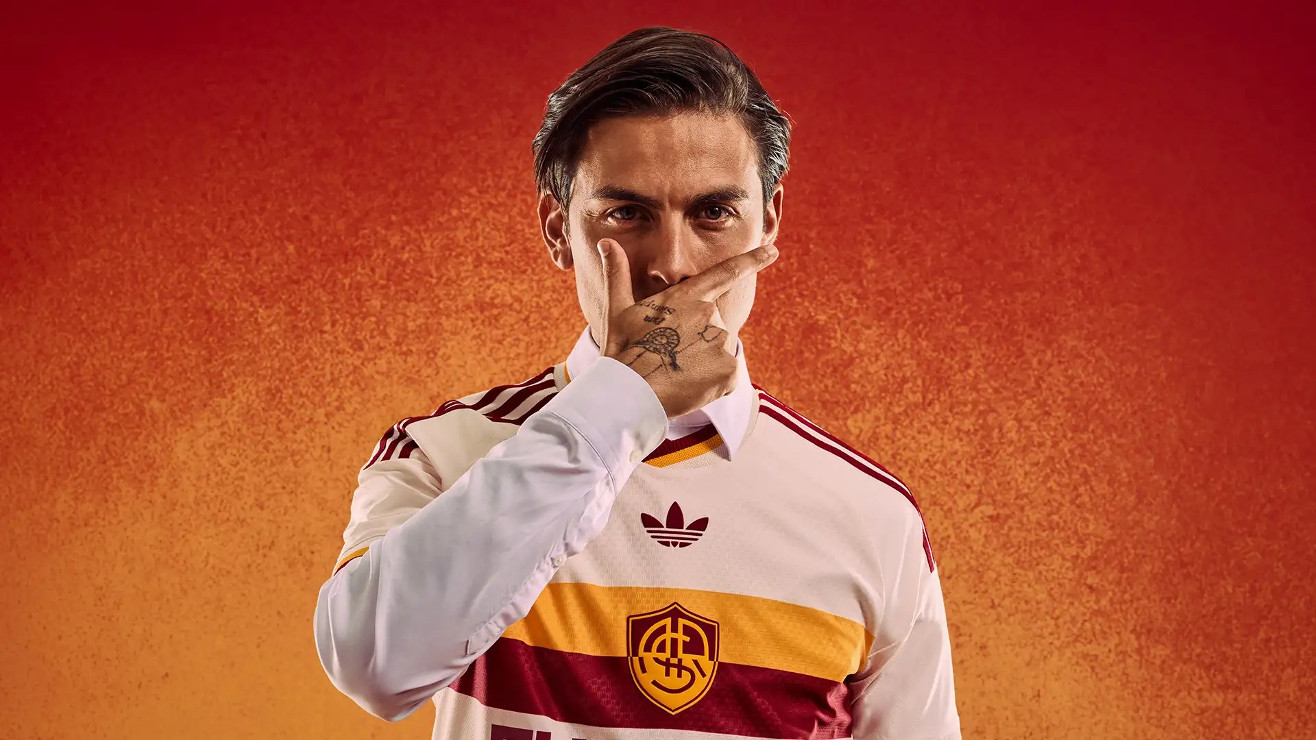 Roma’s white 2026-27 Adidas away shirt with yellow and red chest band