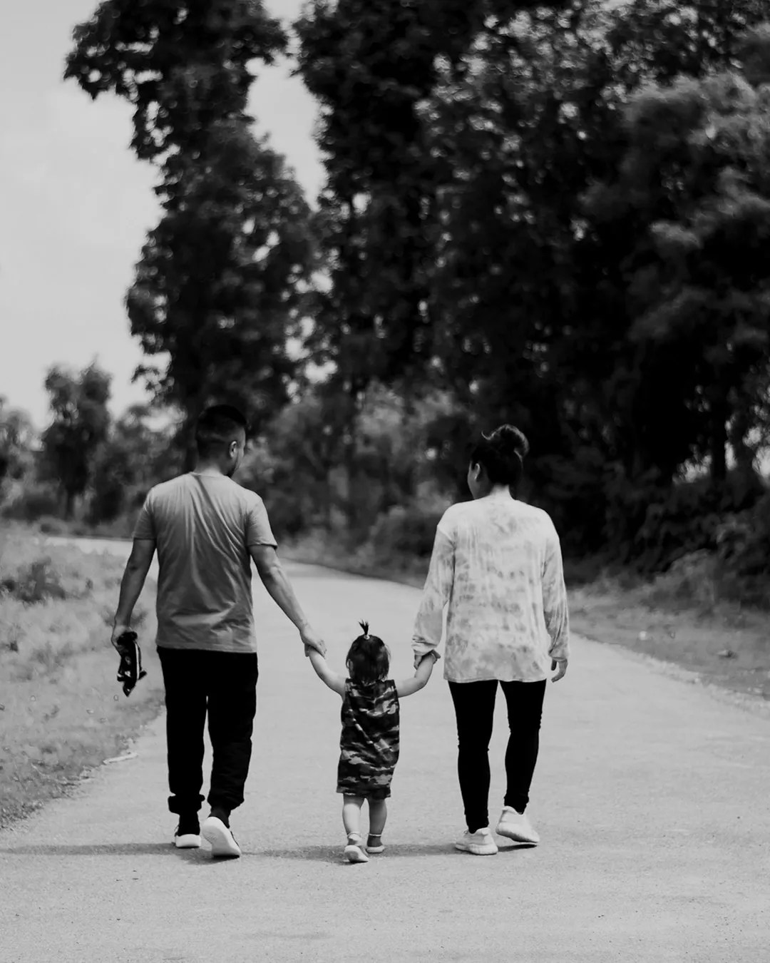 Family walking hand in hand - importance of estate planning