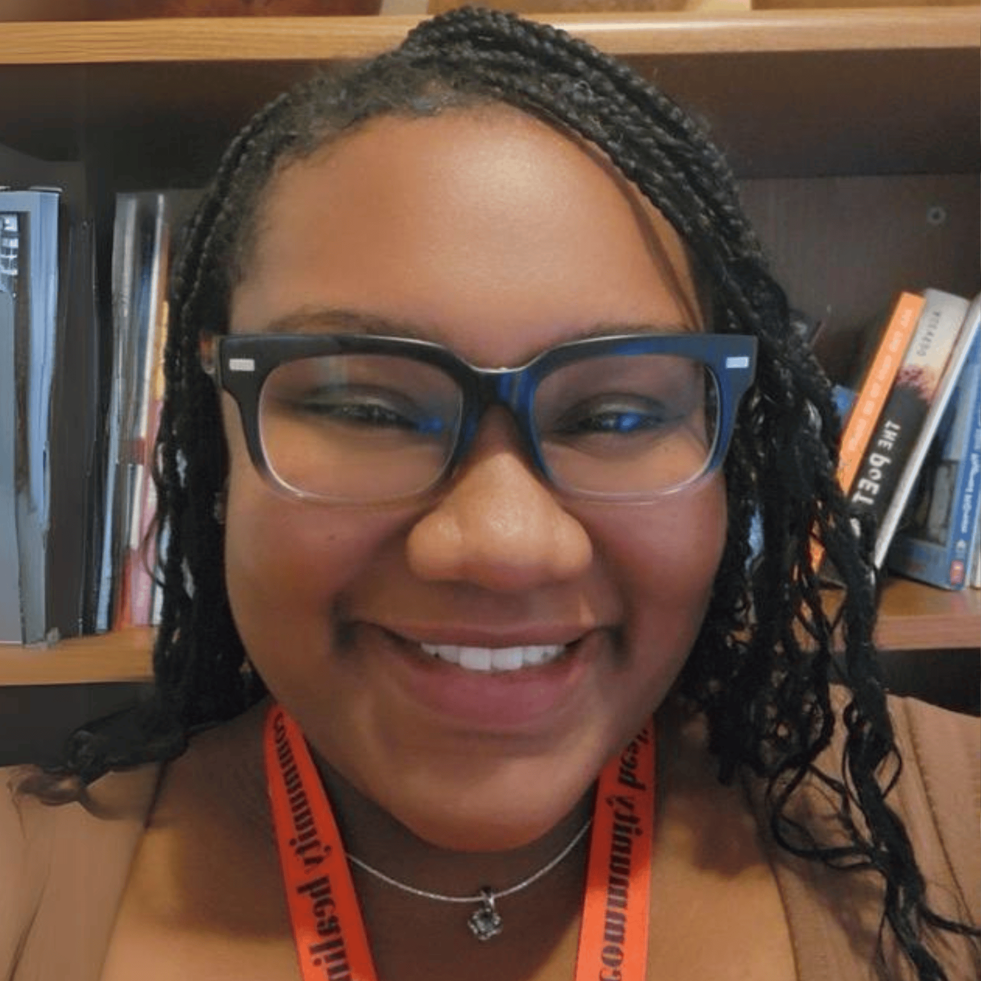 african american woman with glasses smiling