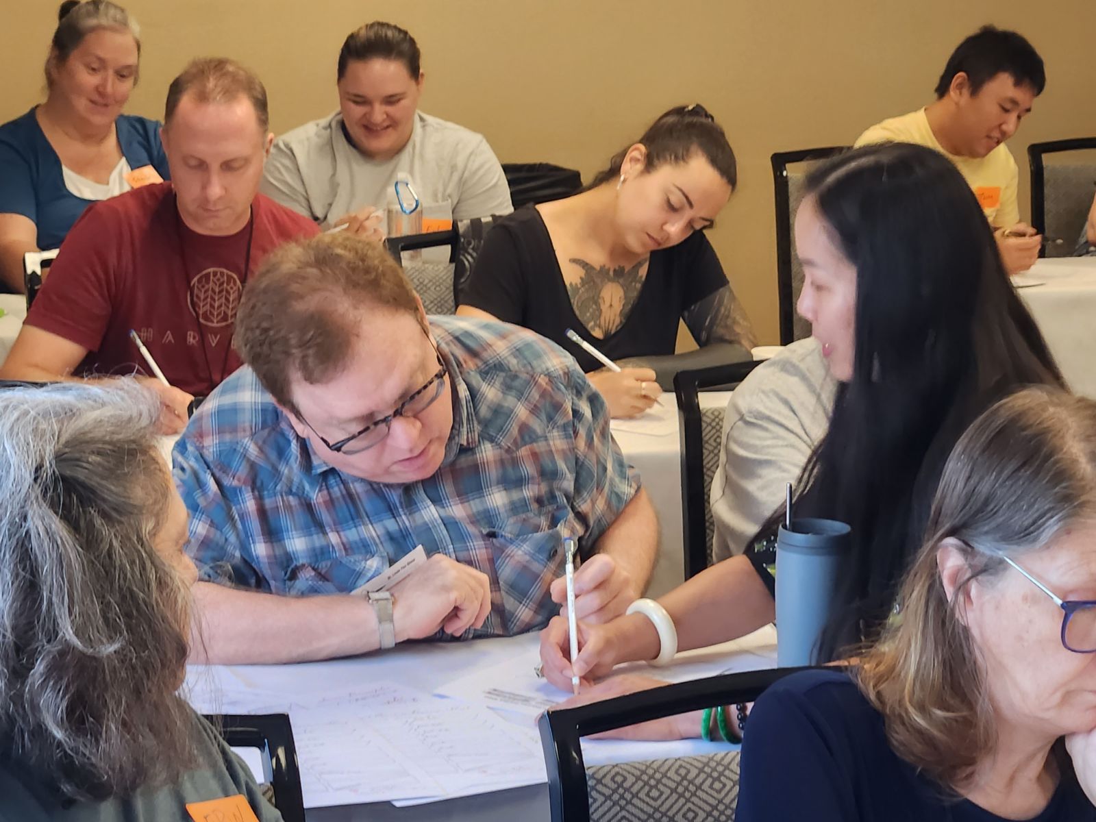 Hong Nguyen demonstrating American Cursive Handwriting techniques to workshop participants.