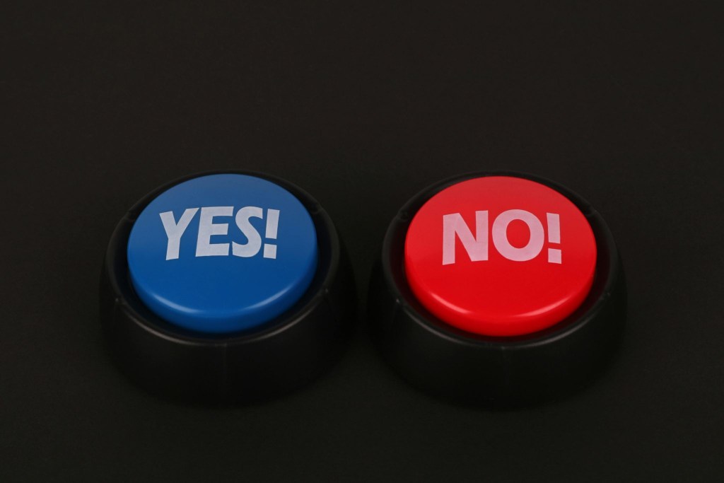 Yes or no button representing decision fatigue for Autistic adults