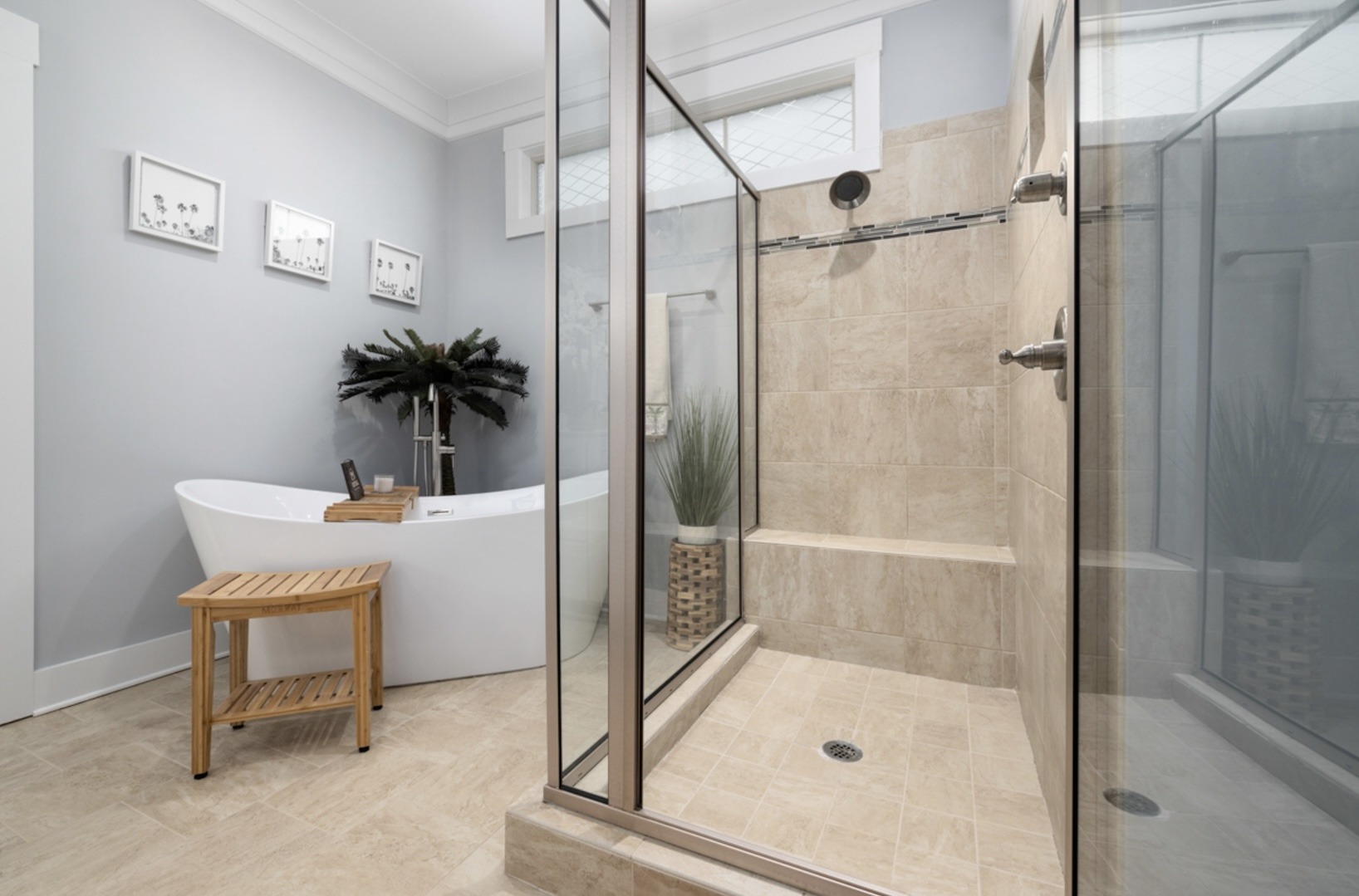 a bathroom with a tub and shower