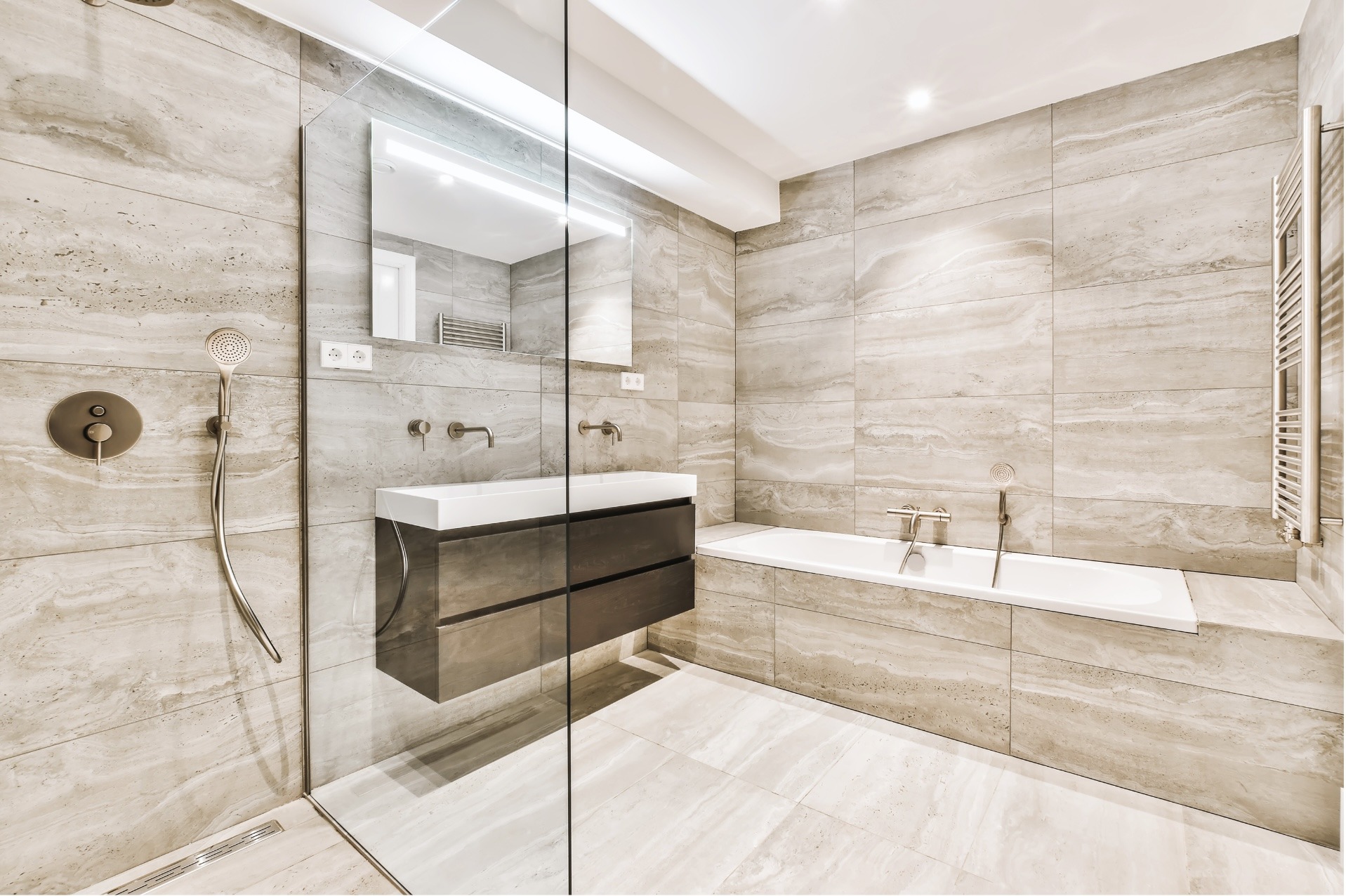 a bathroom with a shower and tub