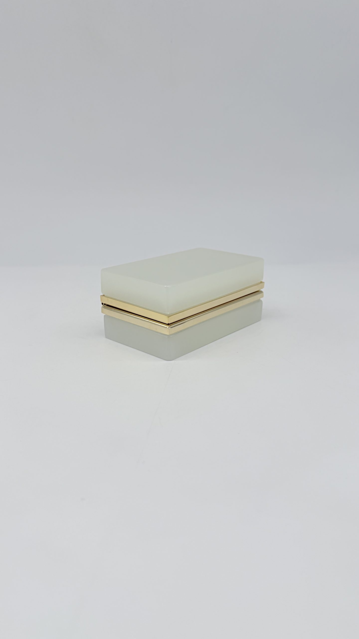 White opaline glass rectangular casket with polished gilt-metal mounts