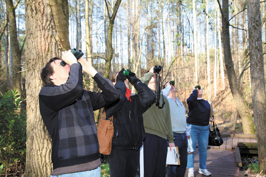 Left to right, David Boyd, the center’s education program manager, Lindsey Gagnon, Jason Gagnon, Roger Gagnon and Nancy Baldwin look to the skies.