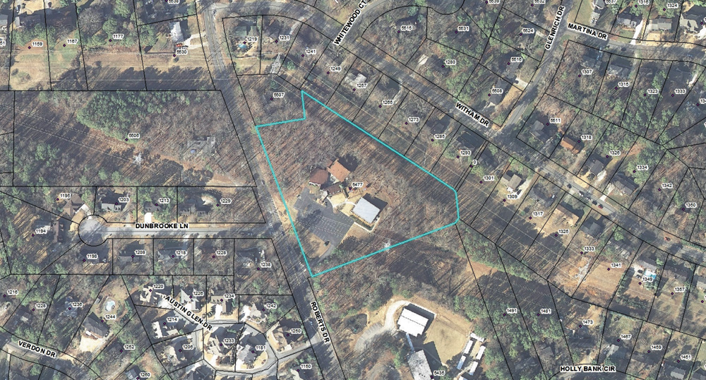 The site is located on the eastern side of Roberts Drive, approximately half a mile north of the intersection with Chamblee Dunwoody Road.