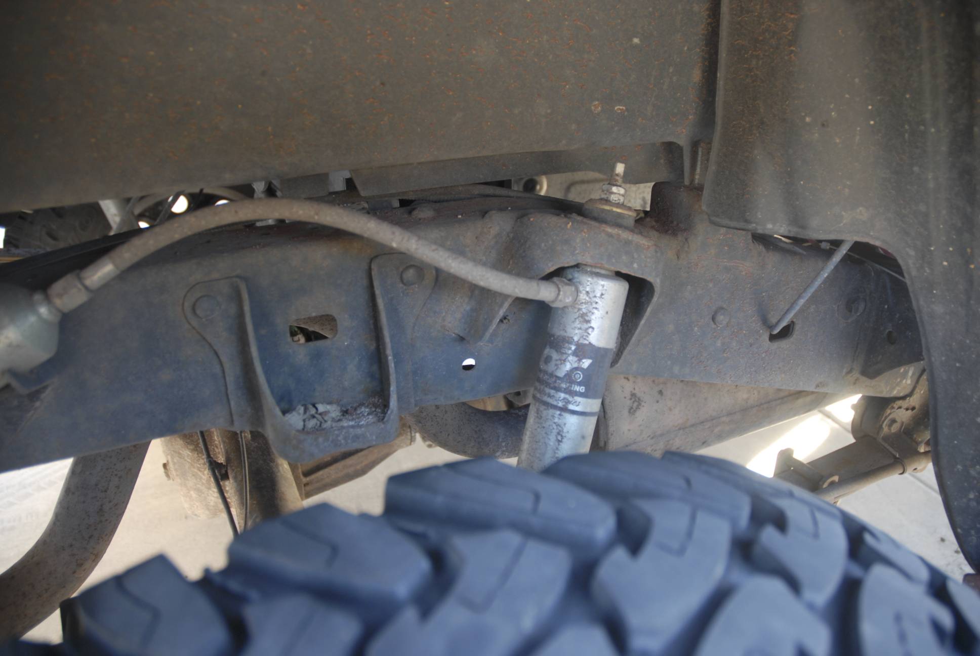 Here's the target zone, and you can see the existing hole in the frame the bracket bolts to.