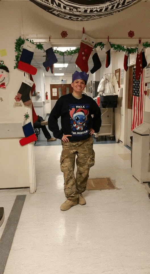Rowdie wearing a Stitch ugly sweater in the hospital during Christmas