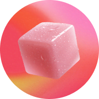 A Roxii Glow Supercube on a pink gradient background