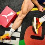 Greg from Rox Lyfe's legs, wearing an orange pair of Puma Deviate Nitro 3 training shoes