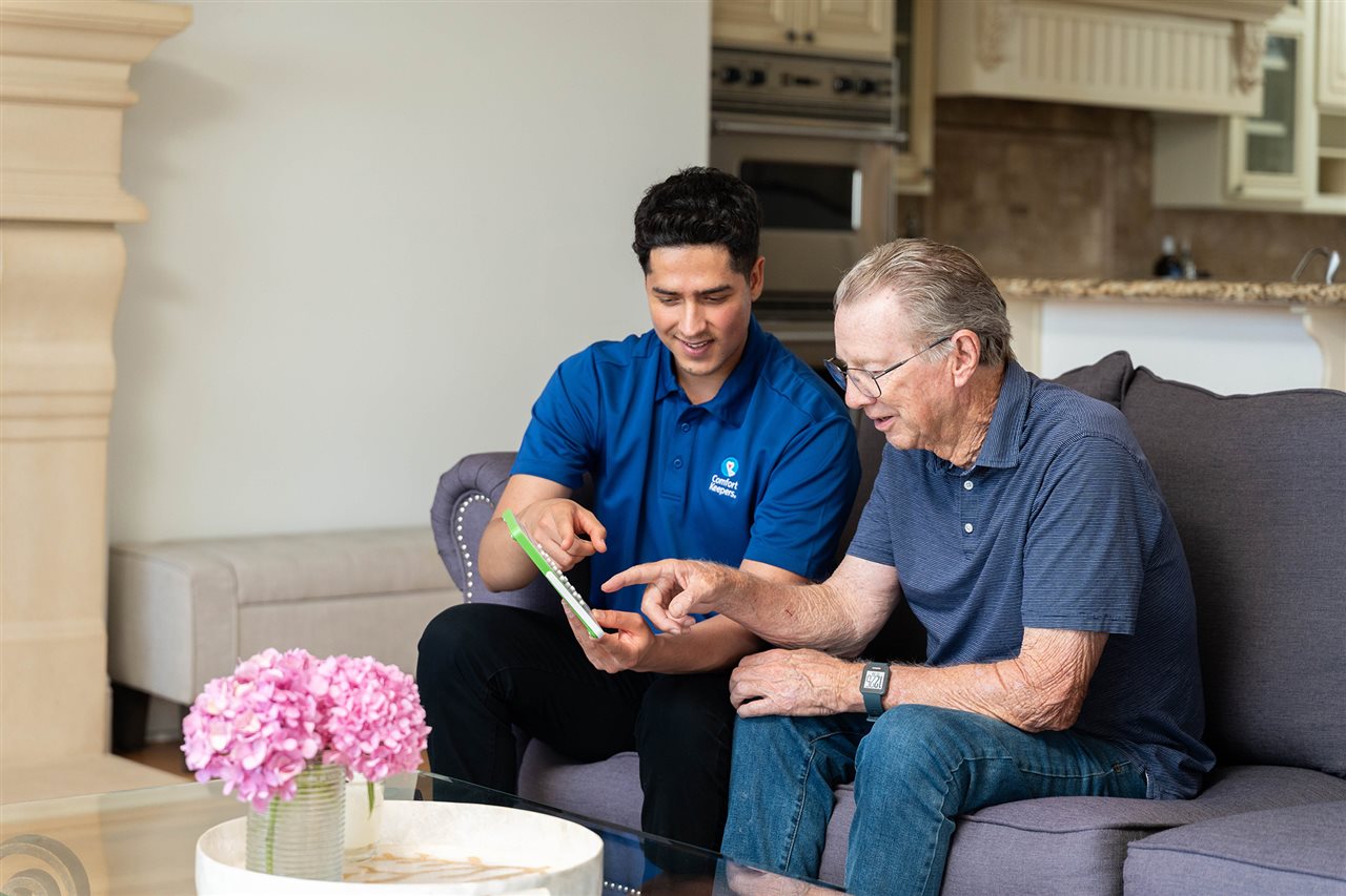Member of the Comfort Keepers team talks with and provides companionship for an aging senior.