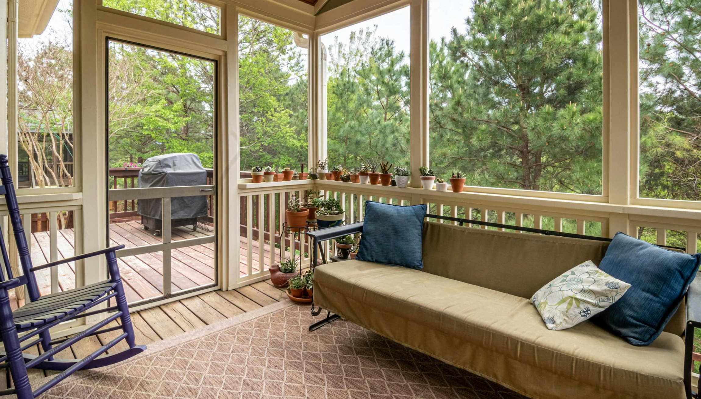 Wooden deck and covered patio in the backyard of a New Jersey home.