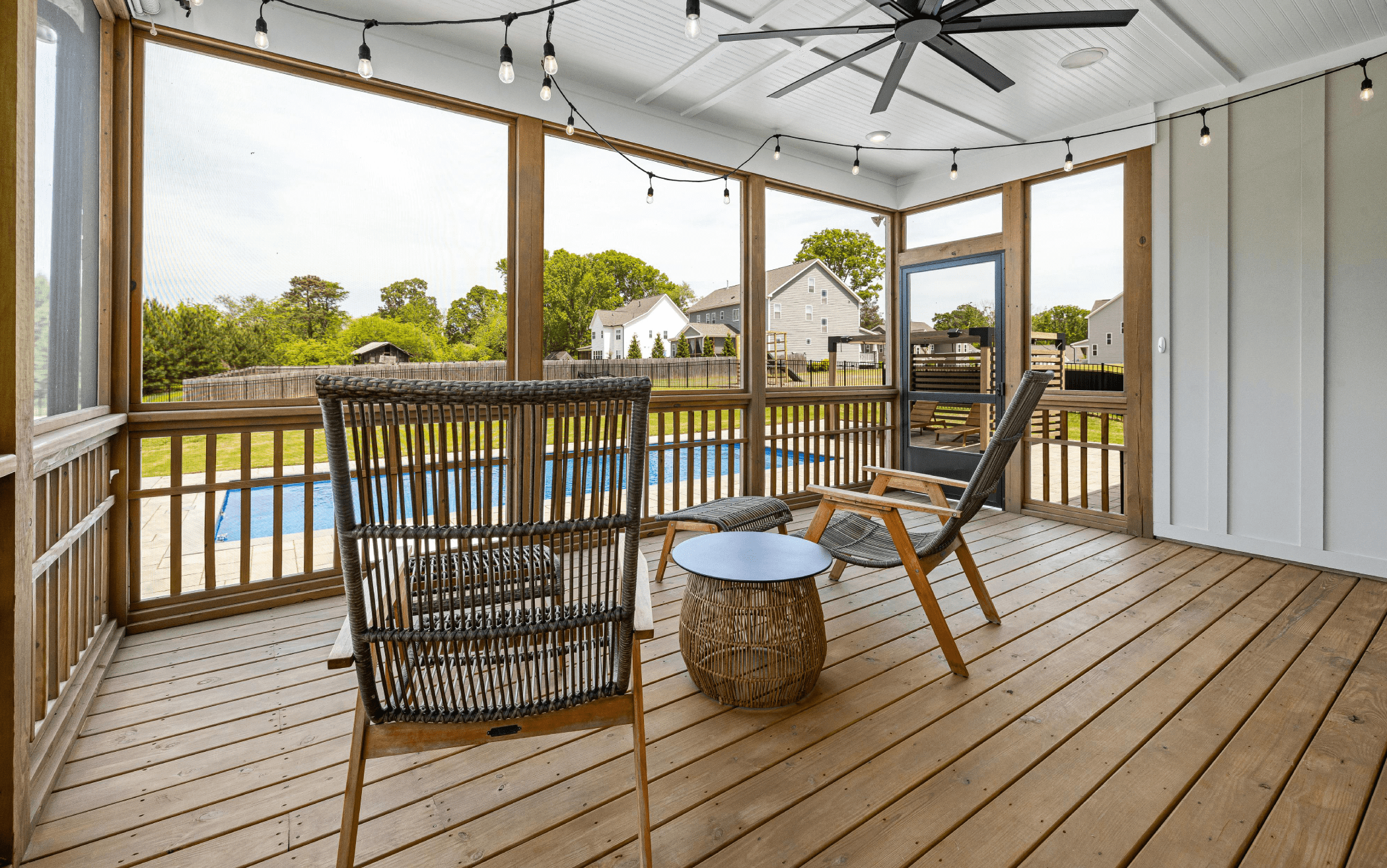 Wooden deck in a New Jersey home with shade covering and fan in a New Jersey home.