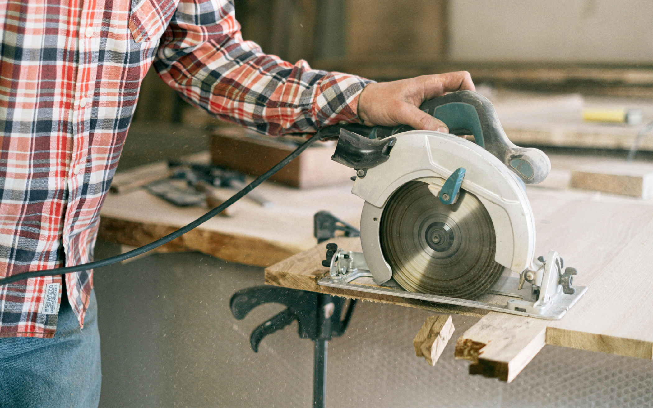 General handyman services for home maintenance in NJ preparing wood panels for repair.