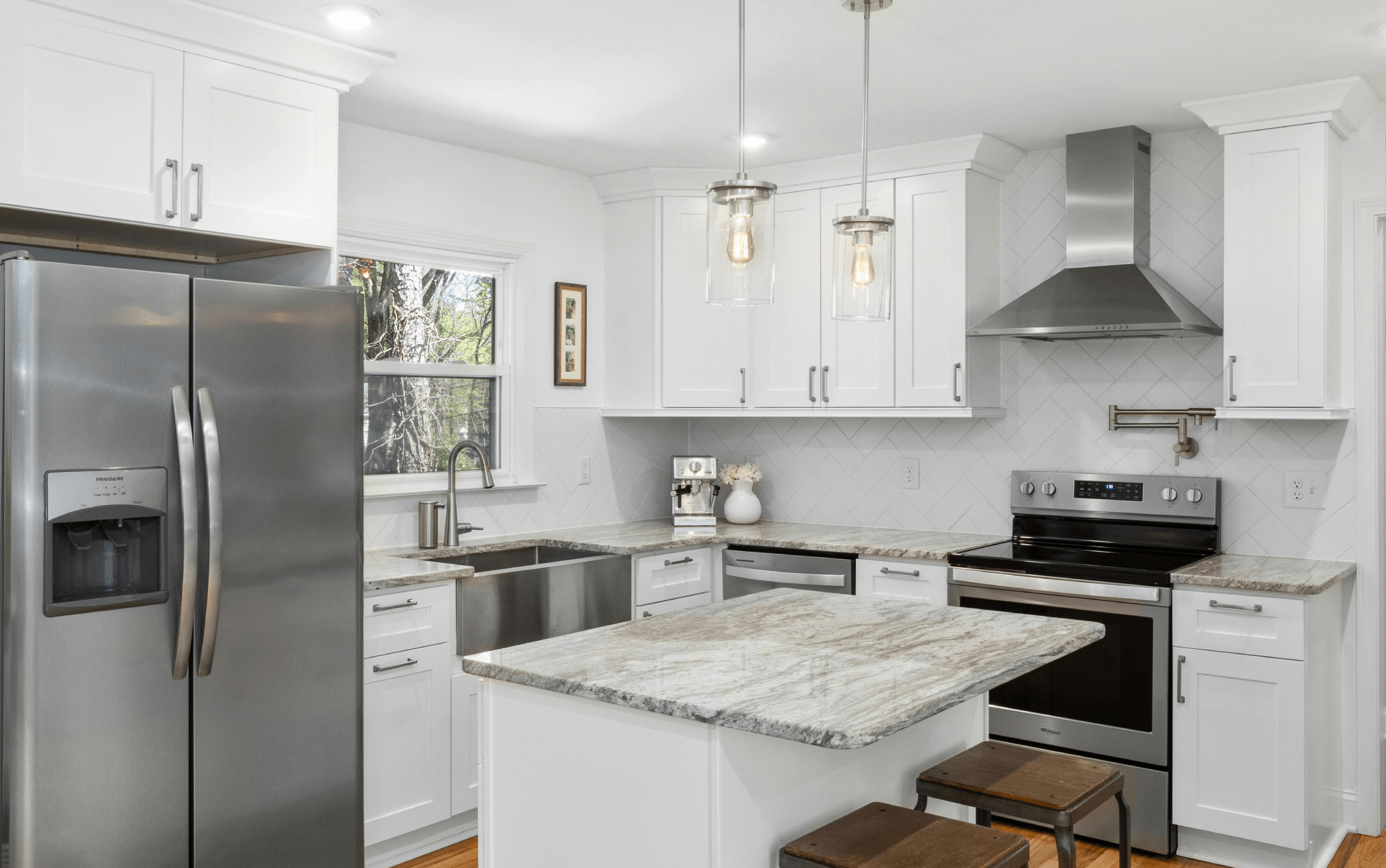 New Jersey kitchen remodel with updated design and appliances with marble countertops.