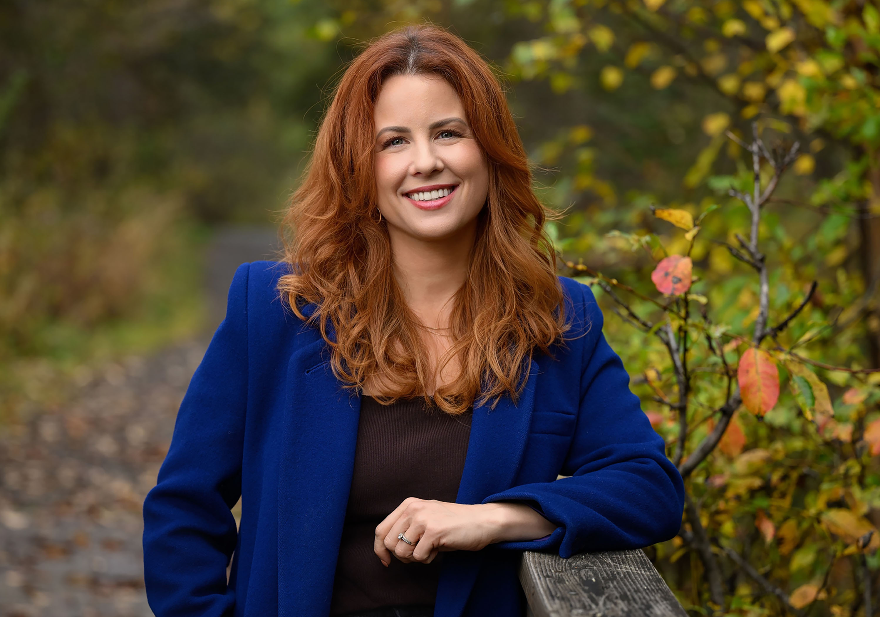 Ruby Jones professional headshot outdoors in a blue blazer