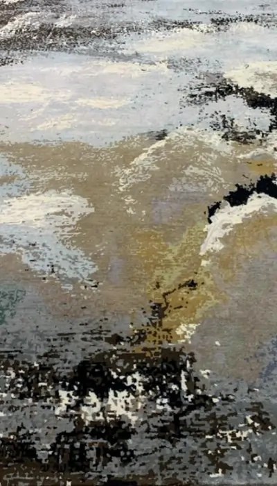 Handmade abstract rug with soft, muted tones resembling a serene natural landscape, perfect for modern interiors