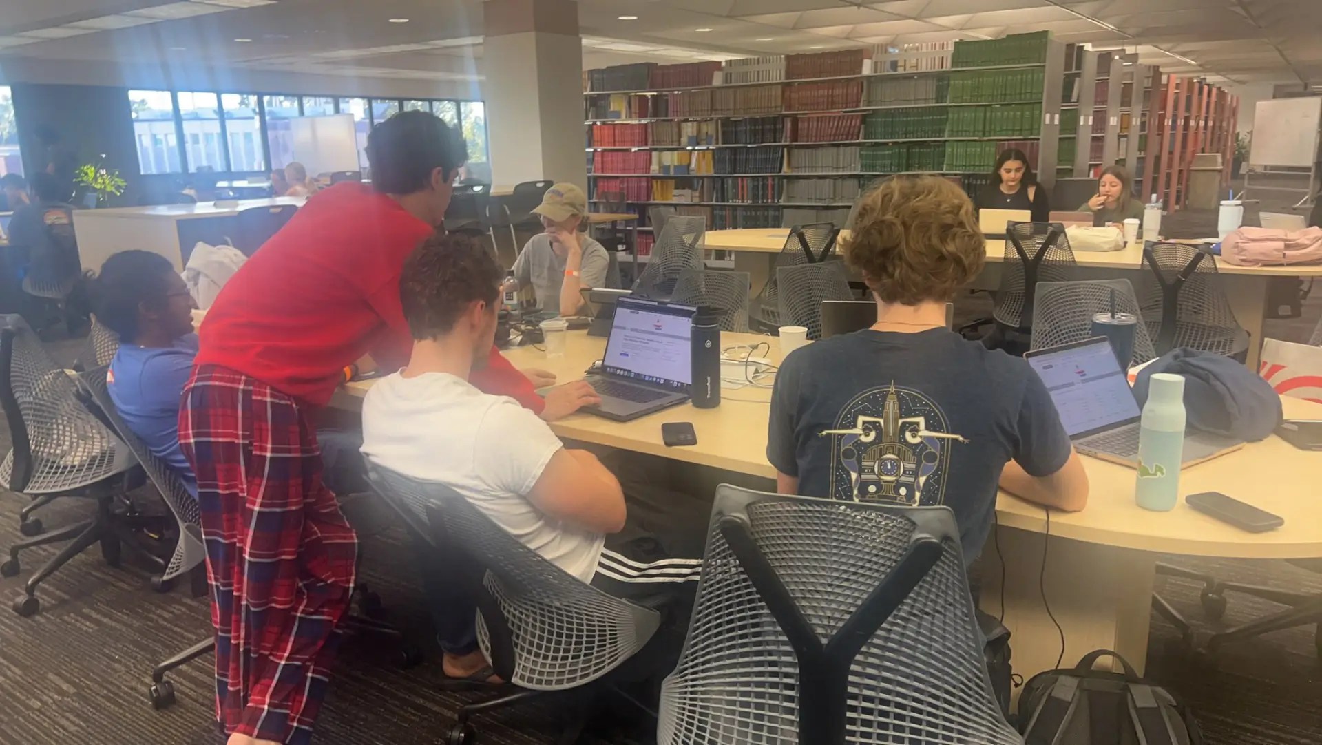 Team OSC in the Marston Science Library coding. We lived in the library for the entire weekend of the competition. One of us even brought an air mattress to make sure we used our limited time wisely!