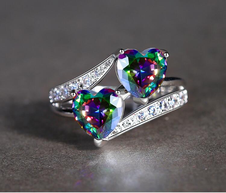 The ring can be interlocking hearts like a love knot on the top of the ring. REIKI HEALING DOUBLE HEART RAINBOW RING