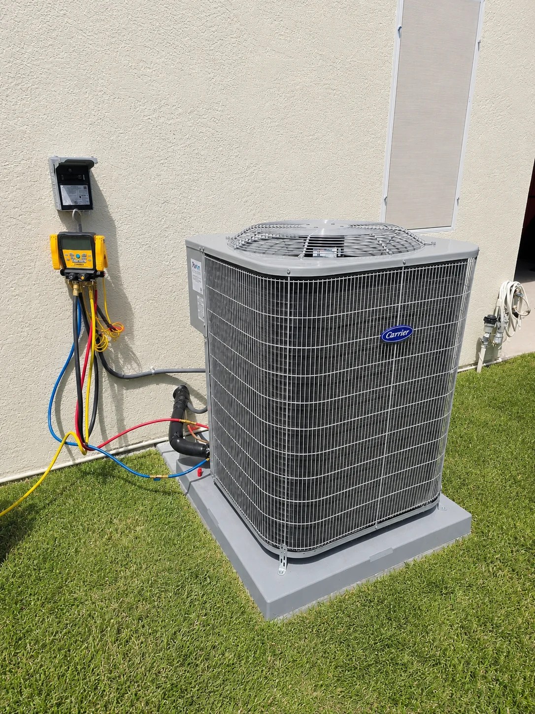 Carrier outdoor AC unit connected to HVAC diagnostic equipment