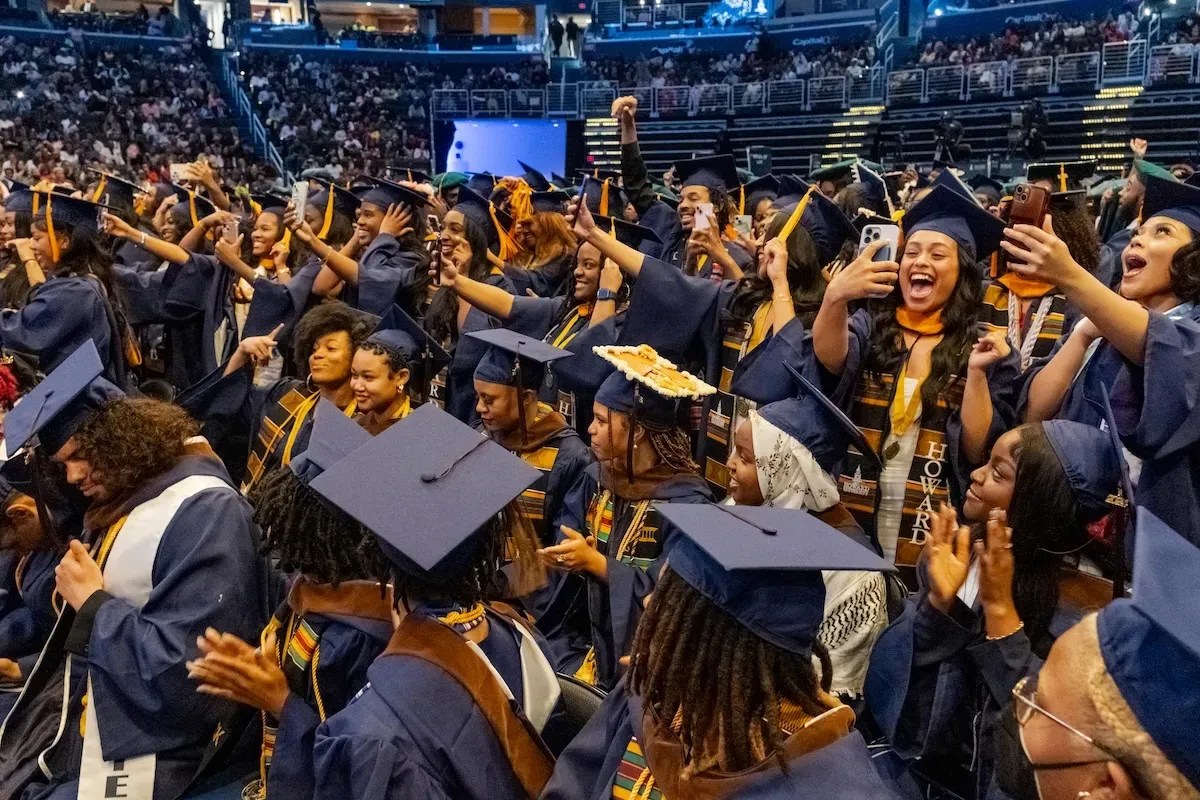 Howard University graduates shout in excitement as each of their departments are officially bestowed their degrees during the 156th commencement convocation. Credit: Ja’Mon Jackson/The Washington Informer