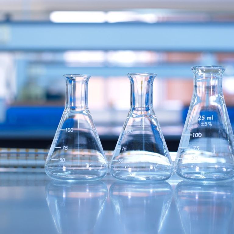 Three Erlenmeyer Flacks on a lab Bench
