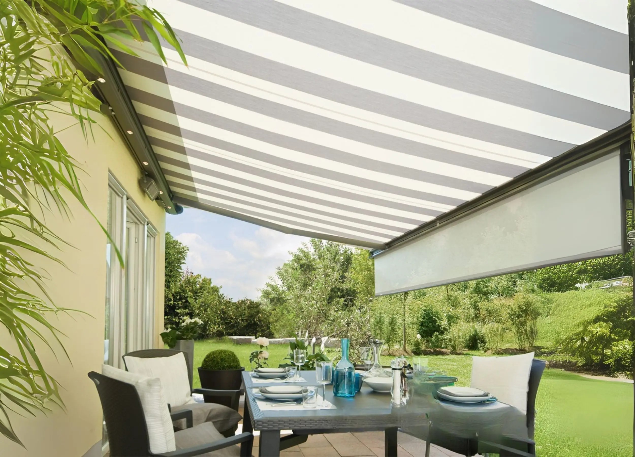 Weinor Opal awning with integrated Valance Plus extended for extra vertical shading on a sunny patio.