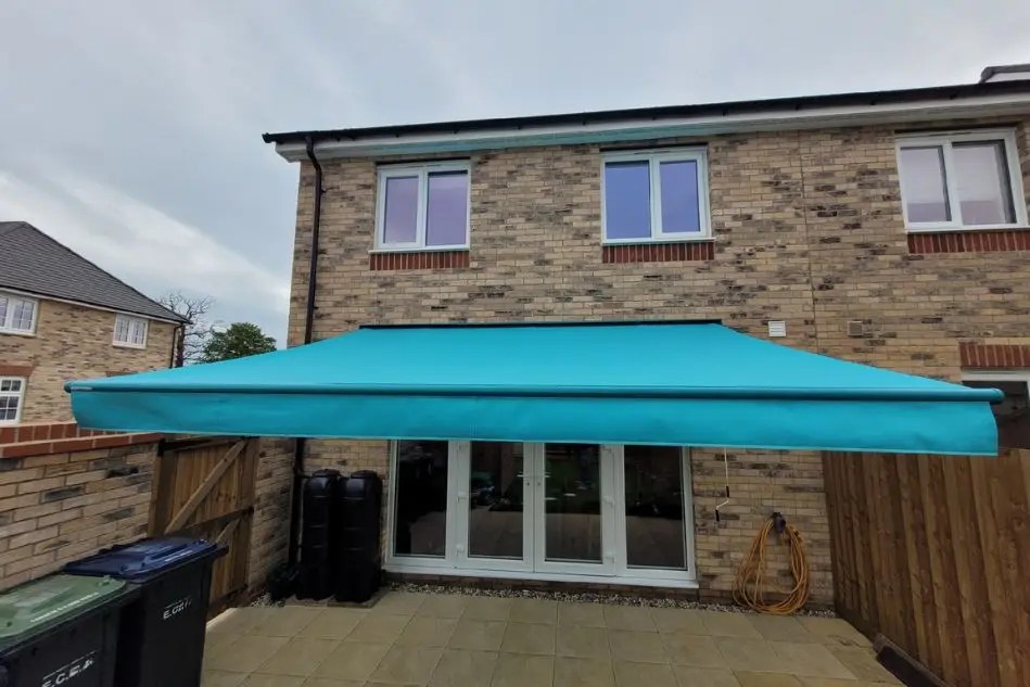 Front view of Weinor Topas awning fully extended in Ely garden