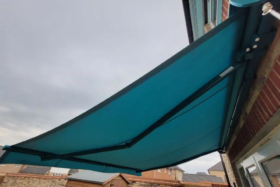 Underside of Weinor Topas awning fabric and arms in Ely