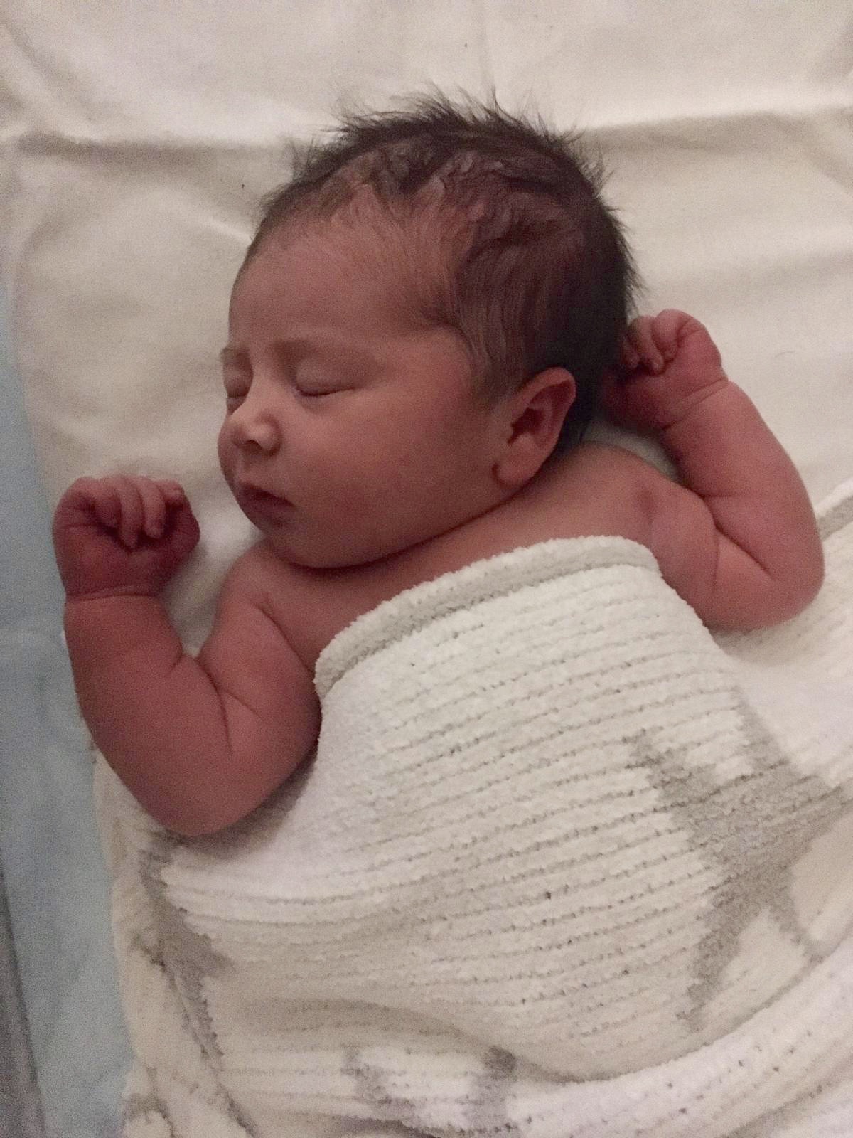 Newborn baby Erin with her fleecy star Asda blanket