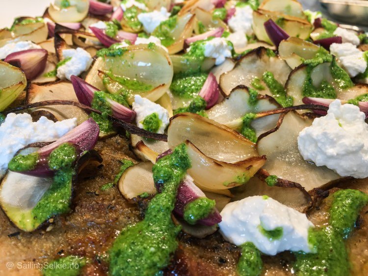 Viking pizza with sun chokes, ramson pesto and smoked goat's