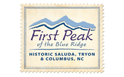 Stamp-shaped logo reading 'first peak of the blue ridge' with blue mountain silhouettes and 'historic saluda, tryon & columbus, nc'.