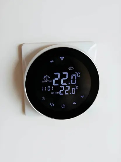 close-up of a modern digital interface displaying room temperature after a programmable thermostat installation in reston virginia.
