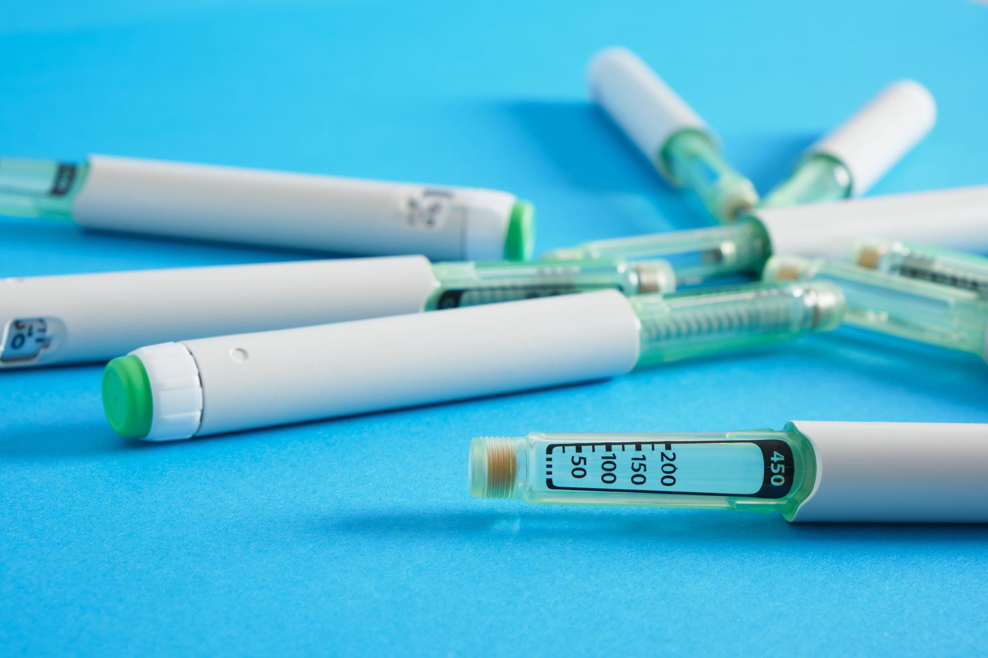 A close up of a GLP-1 injector, like Wegovy, Zepbound, or Ozempic.