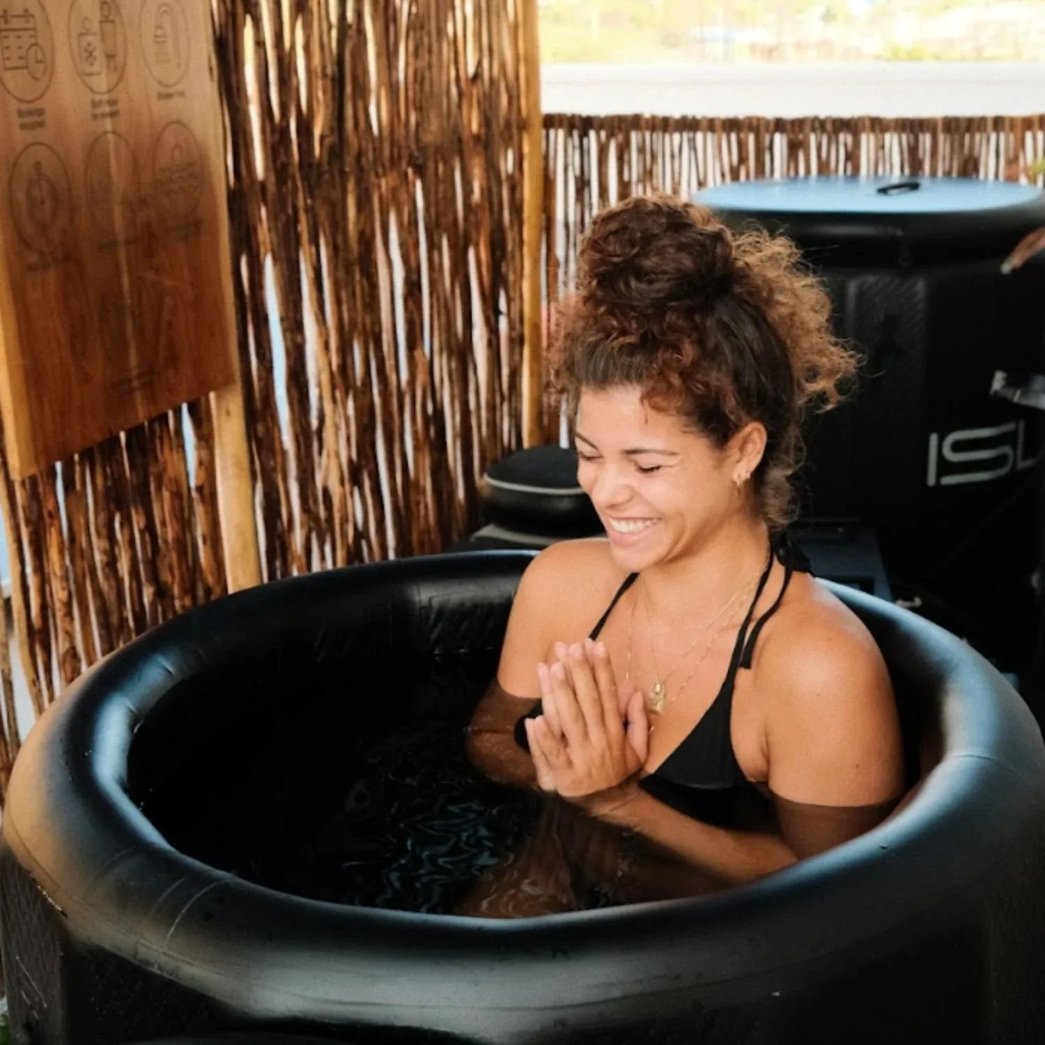Guest taking an ice-bath cold plunge
