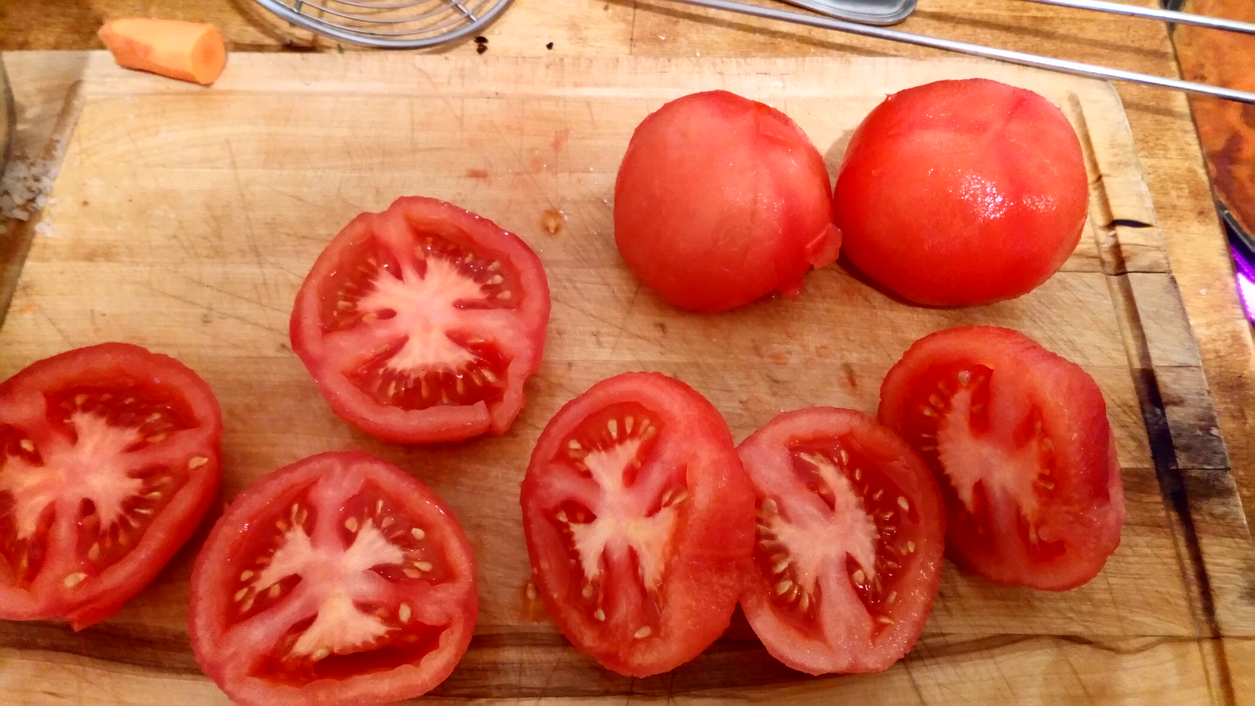 Les peler et les couper en deux pour oter les pépins. Peel them and cut in two to take off seeds.