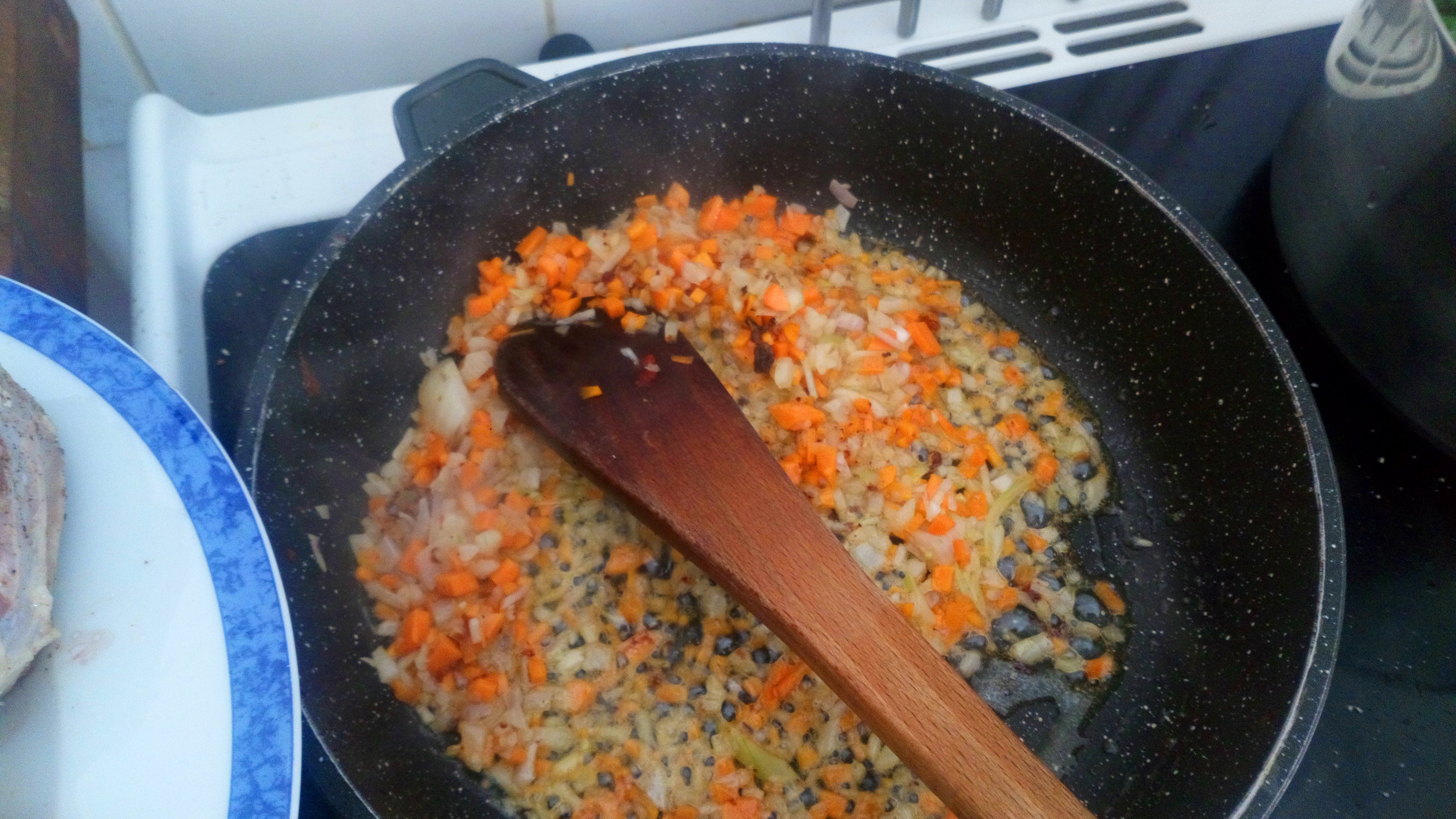 Put minced carrots and onions and sweat them.