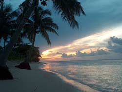 Tan Beach Fales Sunset