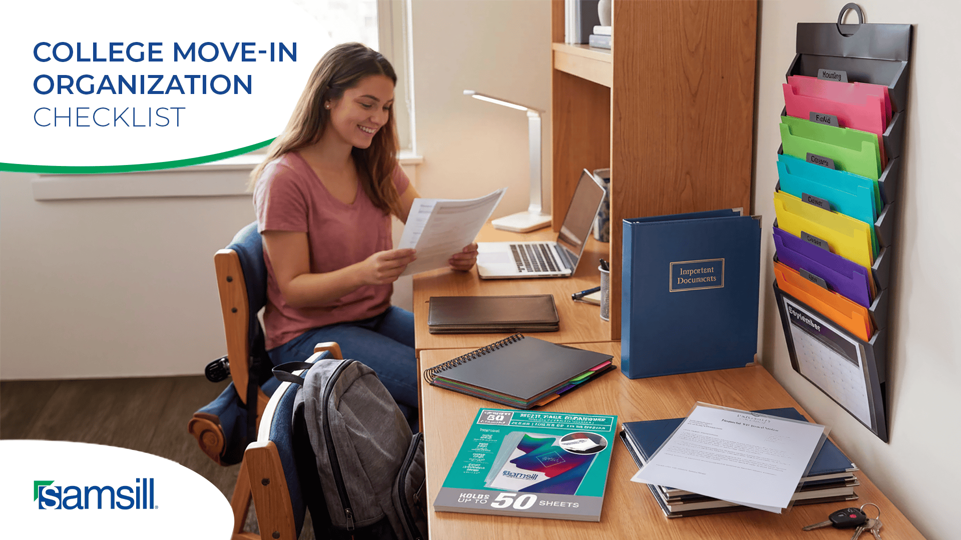 Student Sits at a Dorm Desk Reviewing Documents for a College Move in Checklist with a Laptop Nearby and a Vertical Rack of Colorful Labeled Folders to the Right