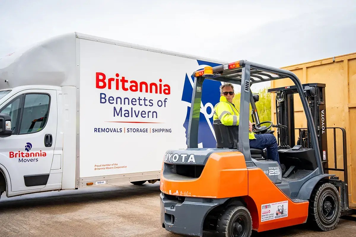 Britannia Sandersteads crew loading a shipping container for removals to Australia