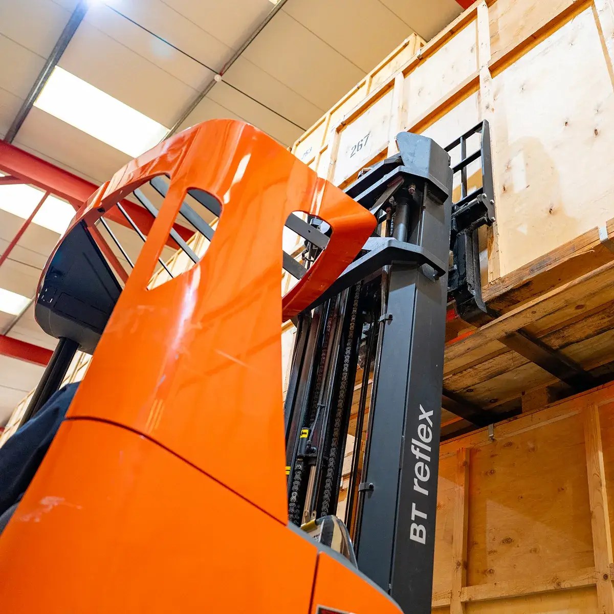 Forklift carefully handling a containerised storage unit inside our Godstone storage depot in Surrey