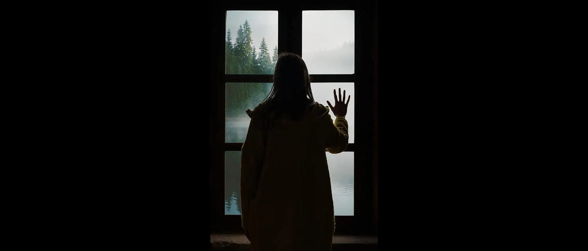 a person standing in front of a window