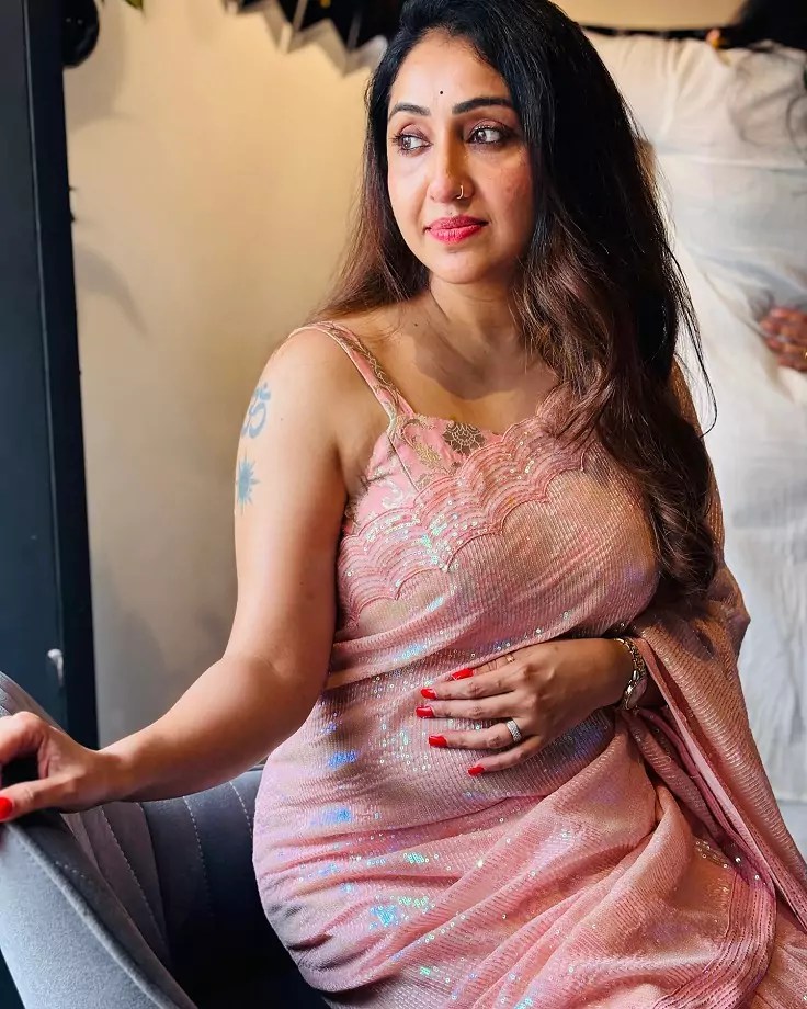 Nithya Das in a modern pastel pink saree, perfect for an evening event.