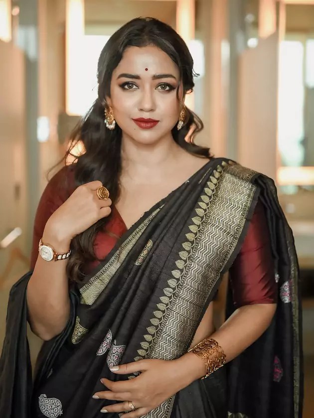 Sohini Sarkar in a black saree with silver border and maroon blouse at Shyamotsav