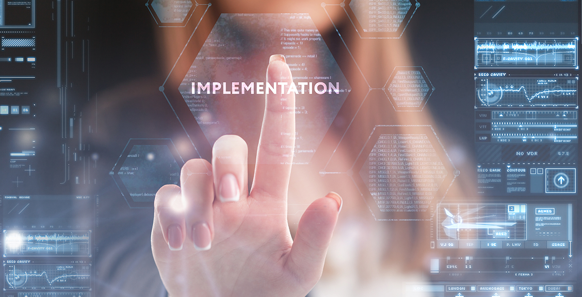 Woman touching clear screen in front of her with Implementation word