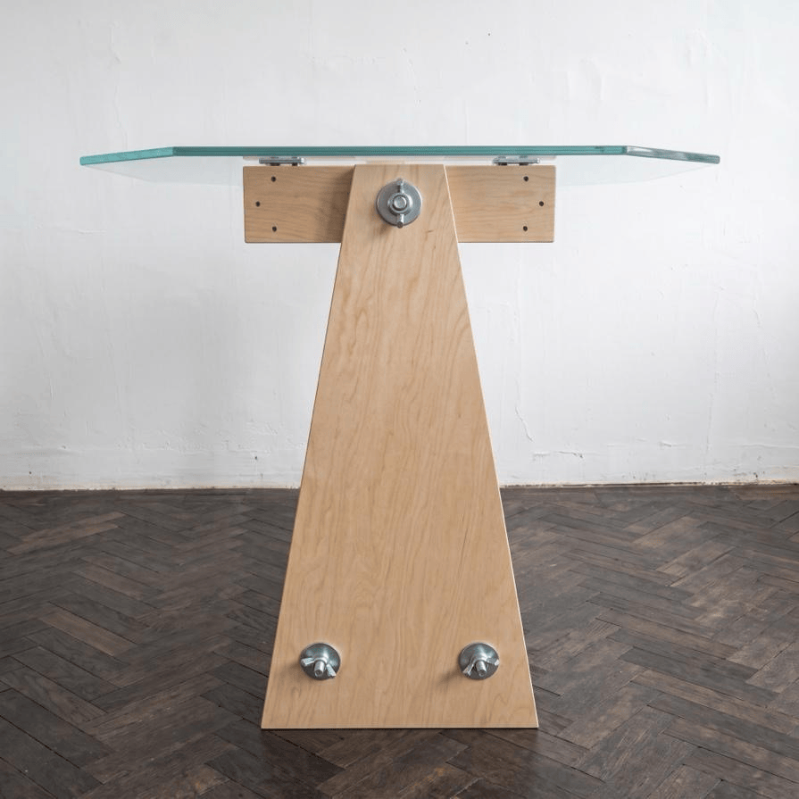 OCTAVE pedestal II plywood table with a glass top