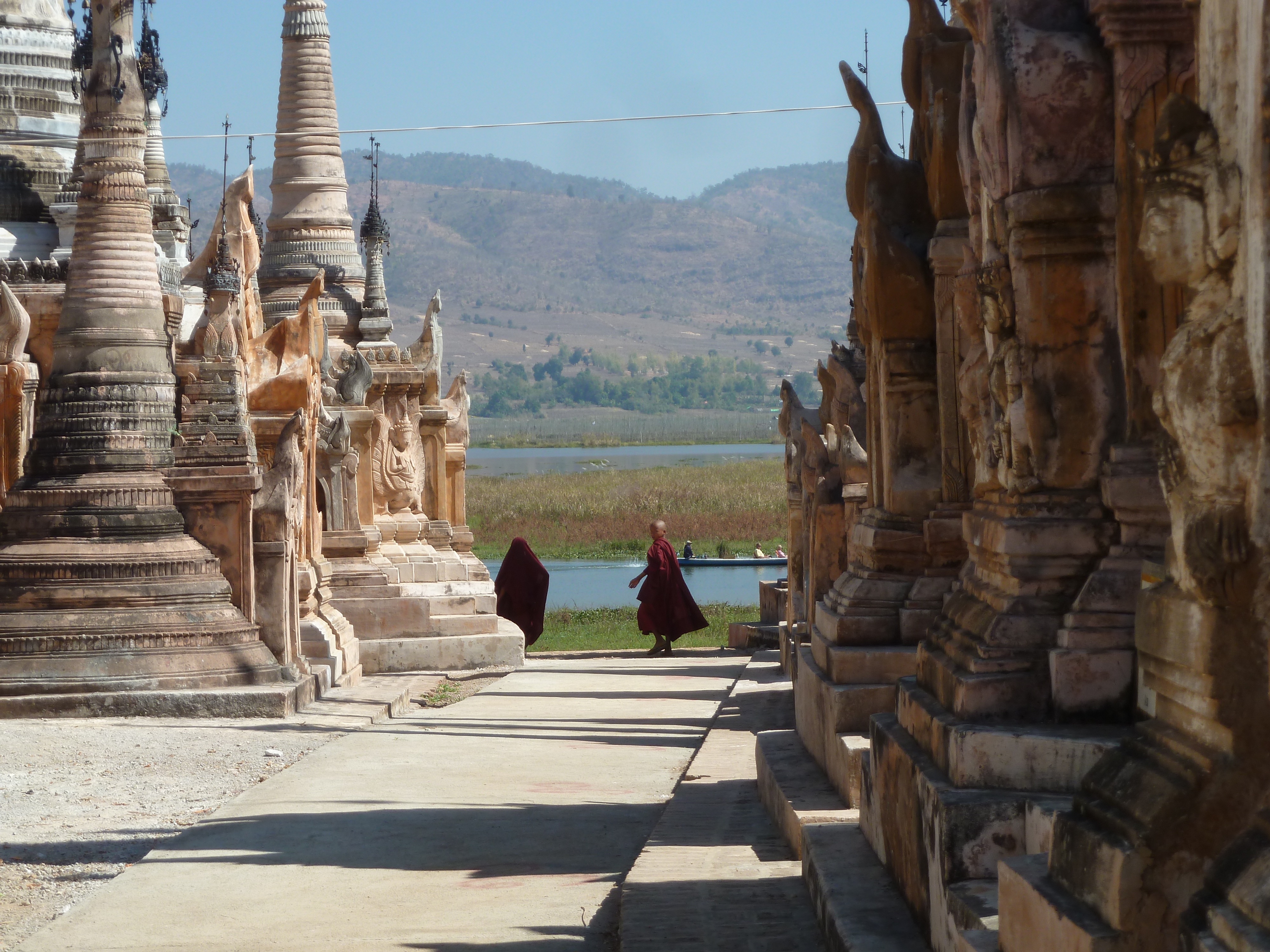 monks running thru pagoda