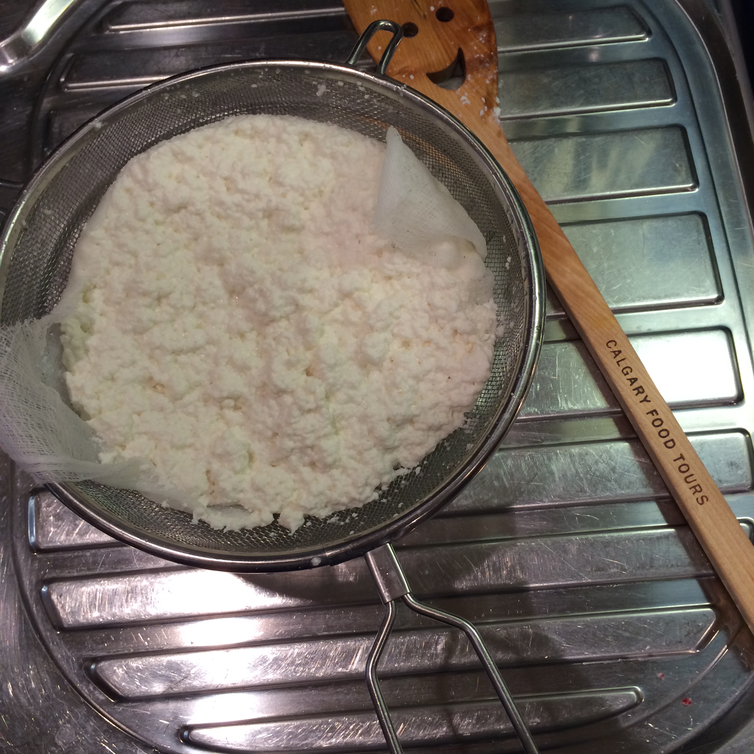 Straining the whey photo - Karen Anderson