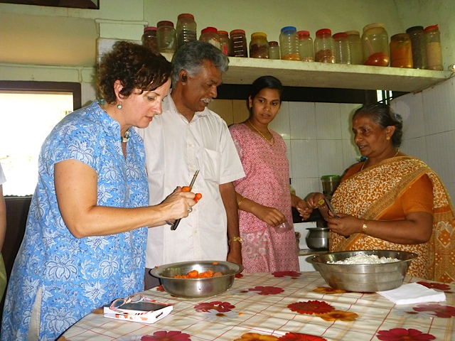 Karen cooking with Mr. Abraham and family - photo - Louise Stirret